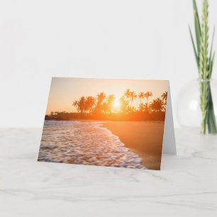 Sonnenuntergang auf dem Strand mit Karte