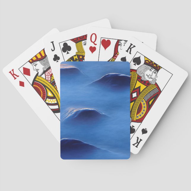 Sonnenuntergang auf Felsen, die durch Schaumwasser Spielkarten (Rückseite)