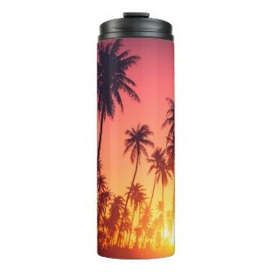 Sonnenuntergang durch tropische Bäume Thermosbecher