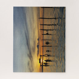 Sonnenuntergang mit Holzpfosten im Wasser Puzzle