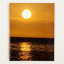 Sonnenuntergang über dem Meer Planer