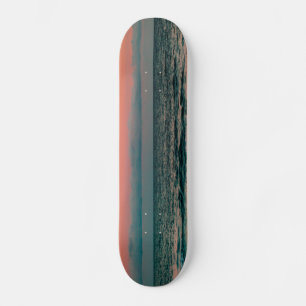 Sonnenuntergang über Meer Skateboard