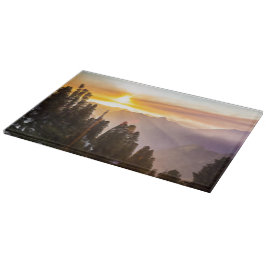 Sonnenuntergang über Wald Schneidebrett