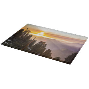 Sonnenuntergang über Wald Schneidebrett