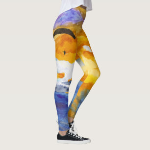 Sonnenunterganggleitschirmfliegen über dem Wasser Leggings