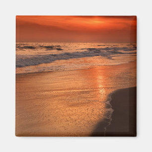 Sonnenuntergangsreflexionen auf Wolken und Ozeankü Magnet