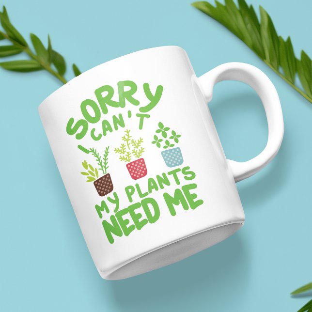 SORRY, ICH KANN MEINE PFLANZE MICH NICHT BRAUCHEN KAFFEETASSE (White mug with the text "Sorry, I can't, my plants need me" and colorful plant illustrations.)