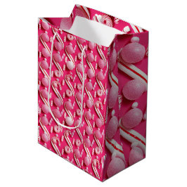 Spielerisch rosa Gummibälle und Minzbonbons Mittlere Geschenktüte
