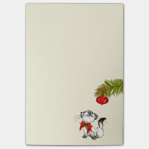 Spielerische Miezekatze-Katze in einem roten Post-it Klebezettel