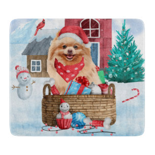 Spitz Hund im Schnee Weihnachtshundehaus Schneidebrett