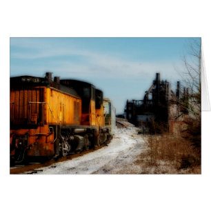 Stahlmühle im Schnee mit Bahn