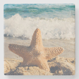 Starfish auf einem Sandy Beach Foto Steinuntersetzer