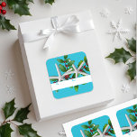 Starfish n Holly Christmas Stickers Aqua<br><div class="desc">Aqua blaue Weihnachtsgeschenksticker mit Seestern und heiligen Design. Zwei Sterne,  grüne Blätter mit roten Beeren bilden dieses Design. Ein weißer Streifen am unteren Rand der quadratischen Aufkleber enthält den "for" und "from" Text. Wählen Sie aus zwei Aufklebergrößen,  aber bitte wählen Sie das matte Finish für das beste Namensschreiben aus.</div>