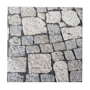 Steine einer Straße im Detail Fliese