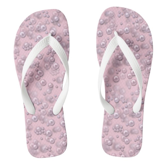 Stellen der weißen rosa Perlen auf rosa Samt Flip Flops (Fußbett)