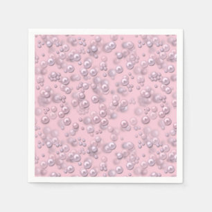 Stellen der weißen rosa Perlen auf rosa Samt Serviette