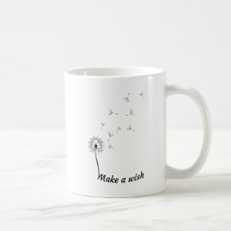 Stellen Sie eine Wunsch-Löwenzahn-trinkende Tasse