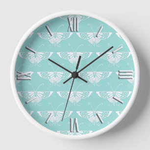 Stilisierter Deko-Schmetterling - eisblau Wanduhr