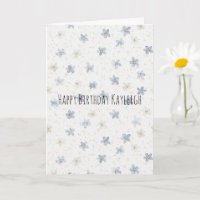 Stilsichere blaue cremefarbene Blumen zum Geburtst
