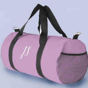 Stilvolle Lila Frauen, die auf eigene Faust oder i Duffle Bag