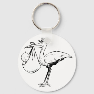 Storch, der ein Baby Keychain hält Schlüsselanhänger
