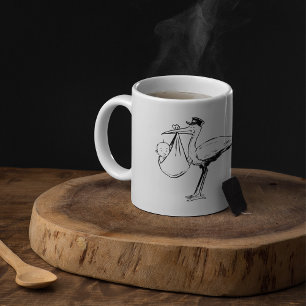Storch mit einer Baby-Tasse Tasse