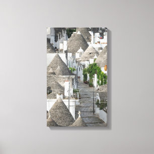 Straße mit Trulli Häusern in Alberobello, Puglia Leinwanddruck
