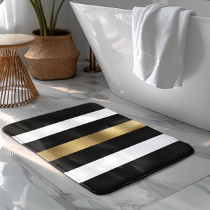 Streifen aus schwarz, weiß und gold badematte