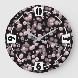 Streuungen aus rosa und weißen Perlen auf schwarze Große Wanduhr