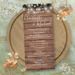 String Lights Rustic Wood Wedding Menu Menükarte<br><div class="desc">Rustikale Hochzeitsmenükarte mit hübschen Saitenleuchten und Signaturstil-Namen,  diese stilvolle Menükarte kann mit Ihren Informationen in schicken weißen Schriftzeichen auf einem Holzpaneelhintergrund personalisiert werden. Entwickelt von Thisisnotme©</div>