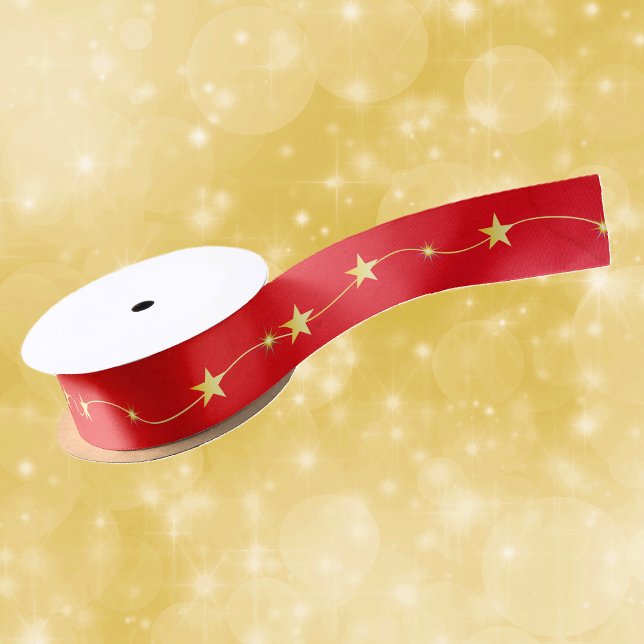 String Shiny Gold Twinkle Stars on Vibranred Red Satinband (Bright shiny twinkle gold stars on string on deep vibrant red Christmas gift or craft ribbon.)