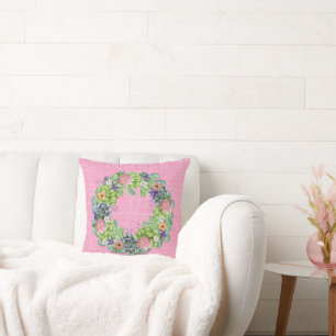 Sukkultureller Blumenstrauß auf Rosa Kissen
