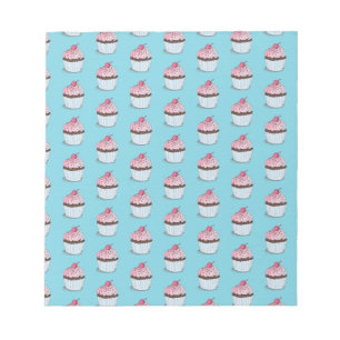 Süße Cupcakes auf blauem Hintergrund Notizblock