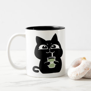 Süße dicke schwarze Katze Kaffeetasse