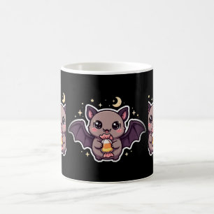 Süße Fledermaus hält Candy Corn Kaffeetasse