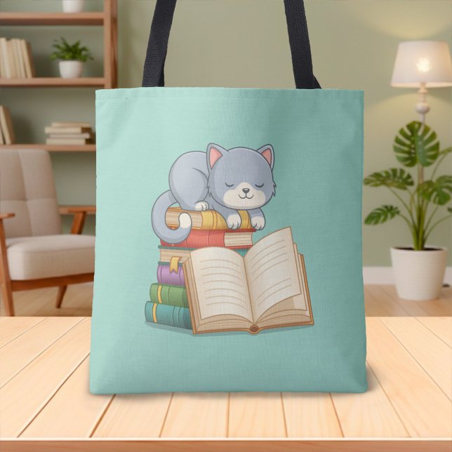 Süße Katze auf einem Bücherstapel Grün (Von Creator hochgeladen)