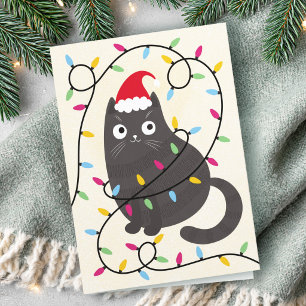Süße Katze mit Weihnachtsmannmütze und Lichtern We Feiertagskarte