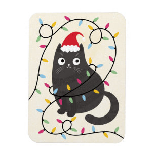 Süße Katze mit Weihnachtsmannmütze und Lichtern zu Magnet