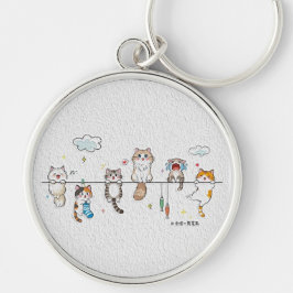 Süße Katzen hängen an einem Schlüsselanhänger