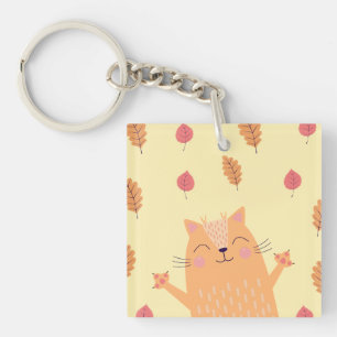 Süße orangefarbene Katze spielt im Herbstlaub Schlüsselanhänger