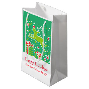 Süße Rentiere hüpfen über Weihnachtsgeschenktüte Kleine Geschenktüte
