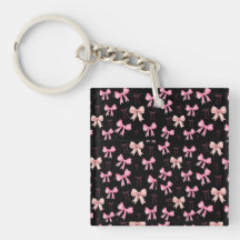 Süße rosa Schleifen auf einem schwarzen Muster Wer