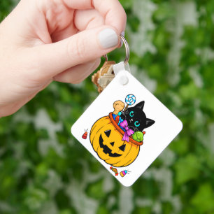 Süße schwarze Katze in einem Jack-O'-Lantern-Kürbi Schlüsselanhänger