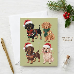 Süße Weihnachts-Dachshunde in Weihnachtsmannmützen Feiertagskarte