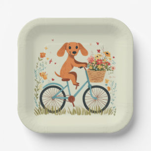 Süßer Dachshund Hund beim Radfahren mit Frühlingsb Pappteller