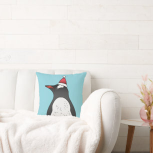 Süßer Gentoo-Pinguin mit Santa-Hut auf Blau Kissen