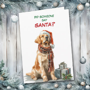 Süßer Golden Retriever sucht nach dem Weihnachtsma Feiertagskarte