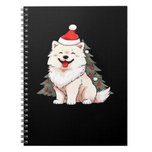 Süßer Hund mit Weihnachtsmannmütze und Weihnachtsb Notizblock