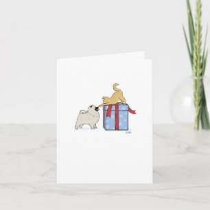 Süßer Keeshond-Welpe und Kätzchen Weihnachten