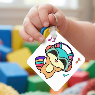 Süßer lächelnder Kawaii-Baby-Waschbär mit Kopfhöre Schlüsselanhänger